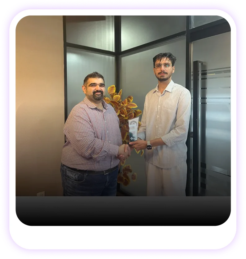 Two HR professionals shaking hands at an HR Lighthouse event