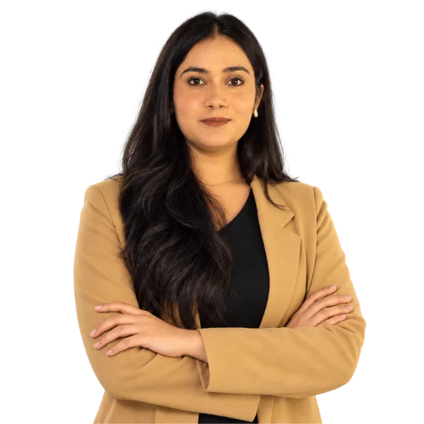 Najma Bibi, CHRMP, Human Resources Generalist, in a tan blazer with arms crossed